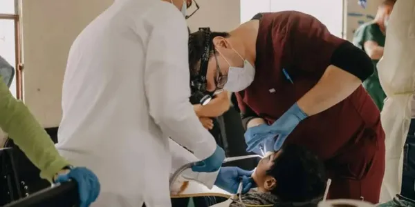 Dr. Eugen Tutunaru serving on a dental mission trip